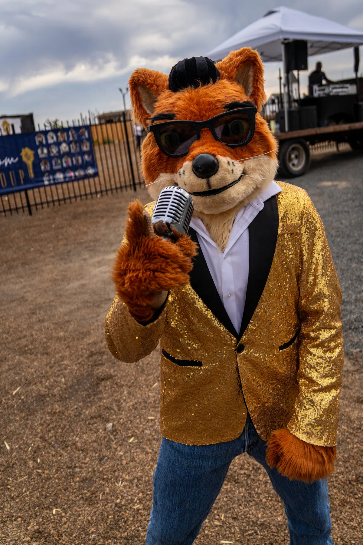Crooner in his gold sequin jacket and sunglasses, holding a vintage microphone