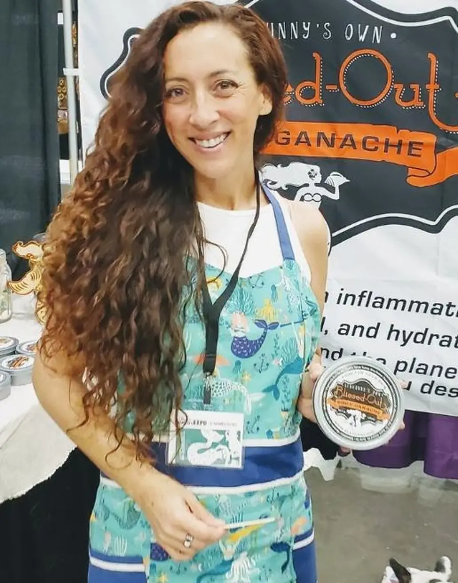 Andie Kat at a trade show with a client product