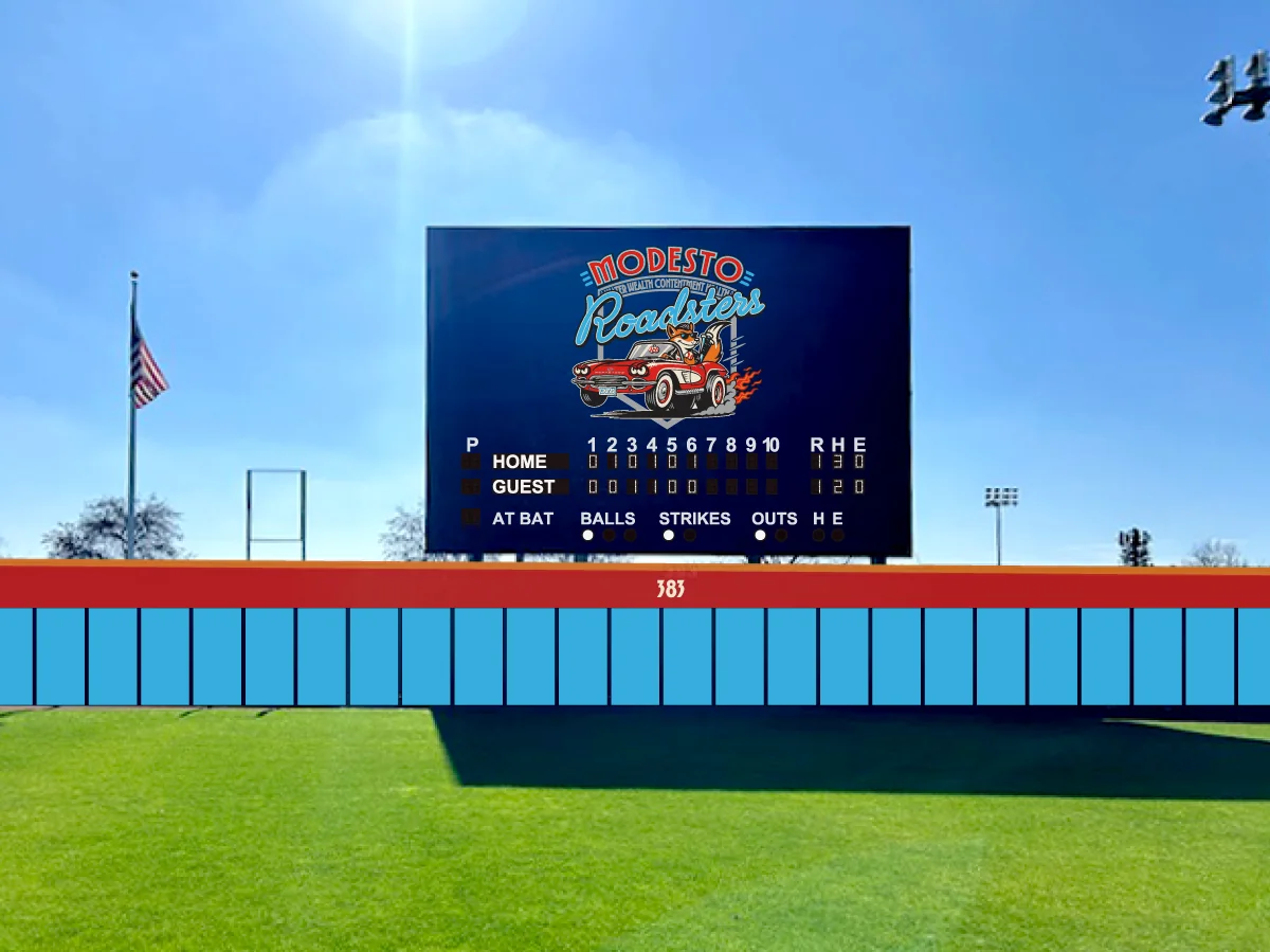 The ballpark scoreboard in place at the stadium, carrying the Modesto Roadsters mark above the outfield wall