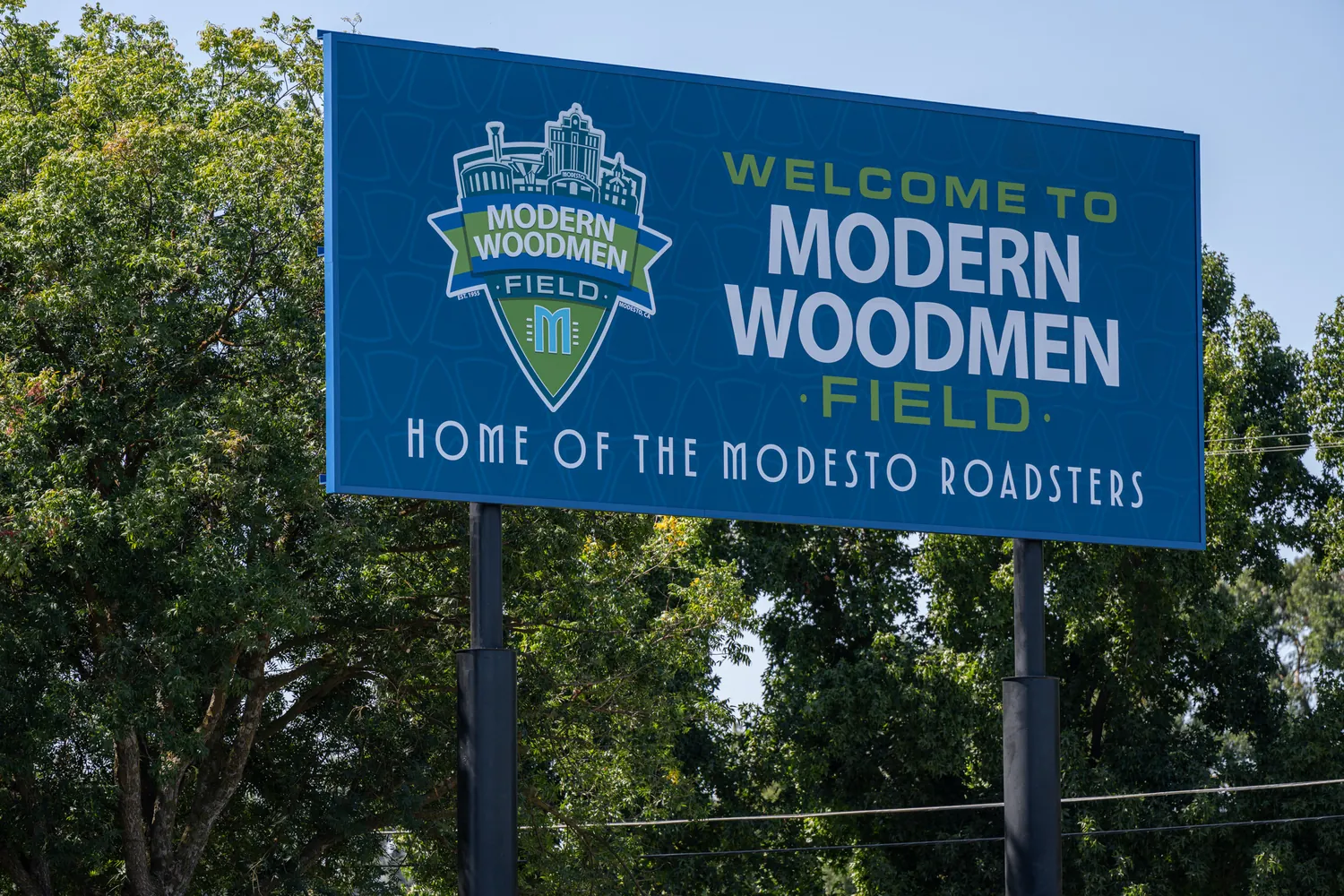 The freestanding Welcome to Modern Woodmen Field sign, Home of the Modesto Roadsters.
