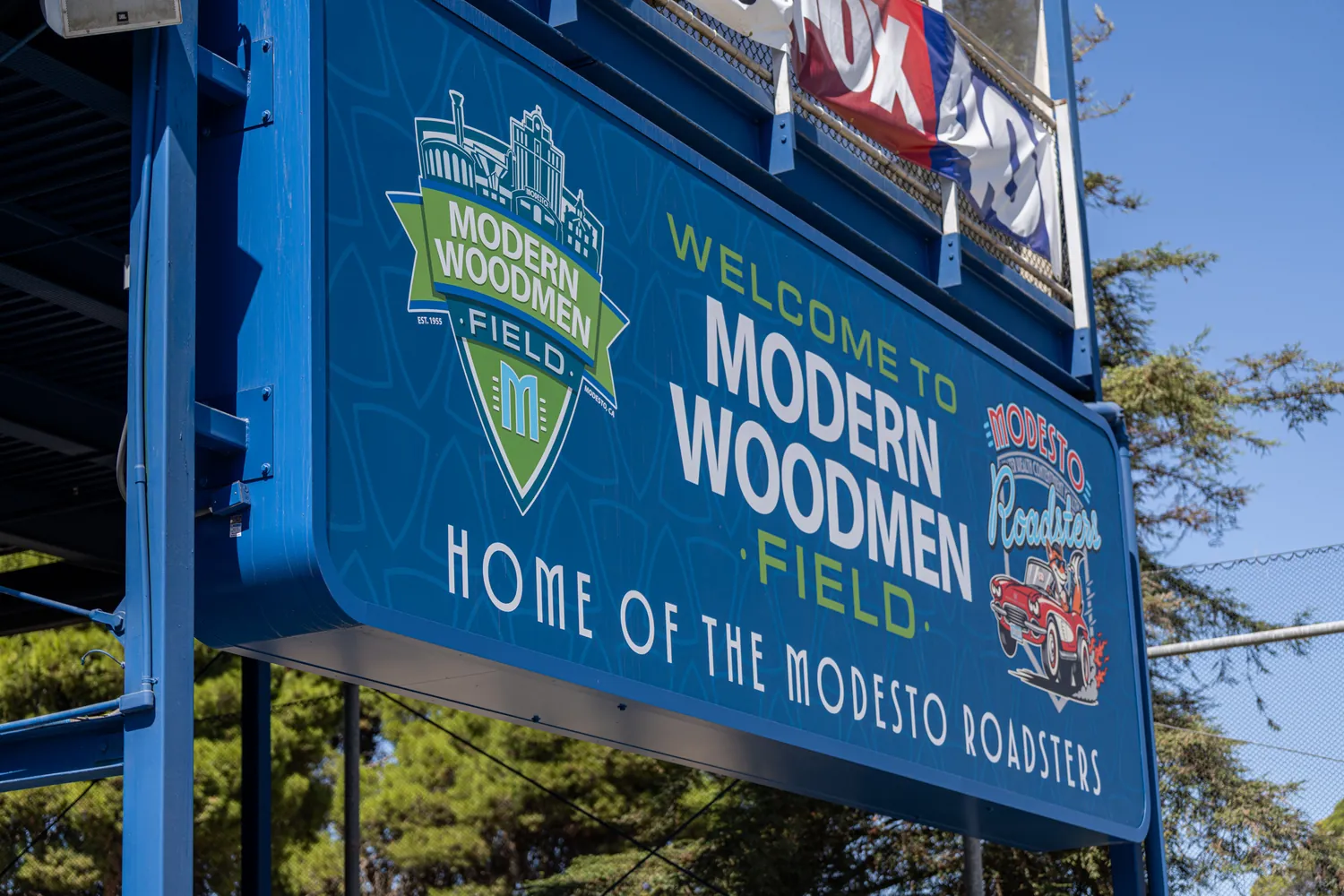 The welcome sign above the outfield advertising boards.