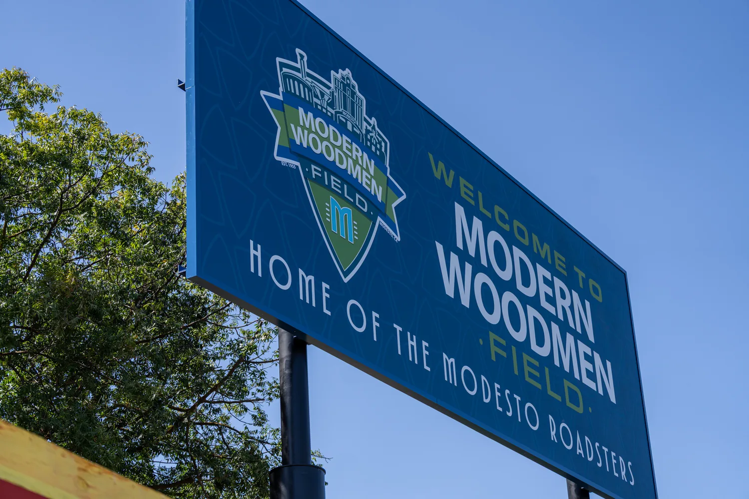 The right center field sign seen from below against open sky, 15 feet high and 40 feet wide, the largest sign in the package